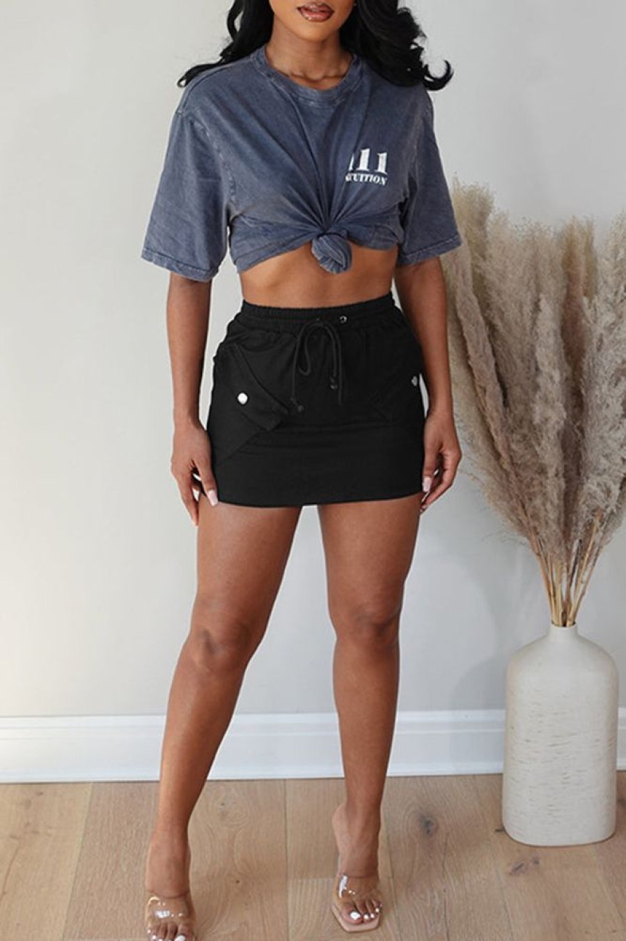 Bottoms female | Casual Drawstring Solid Color Elastic Waist Package Hip Short Skirt