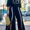 2-Pieces female | Elegant Abstract Half Sleeve Top With Contrasting Trim Slit Pant Suits Black